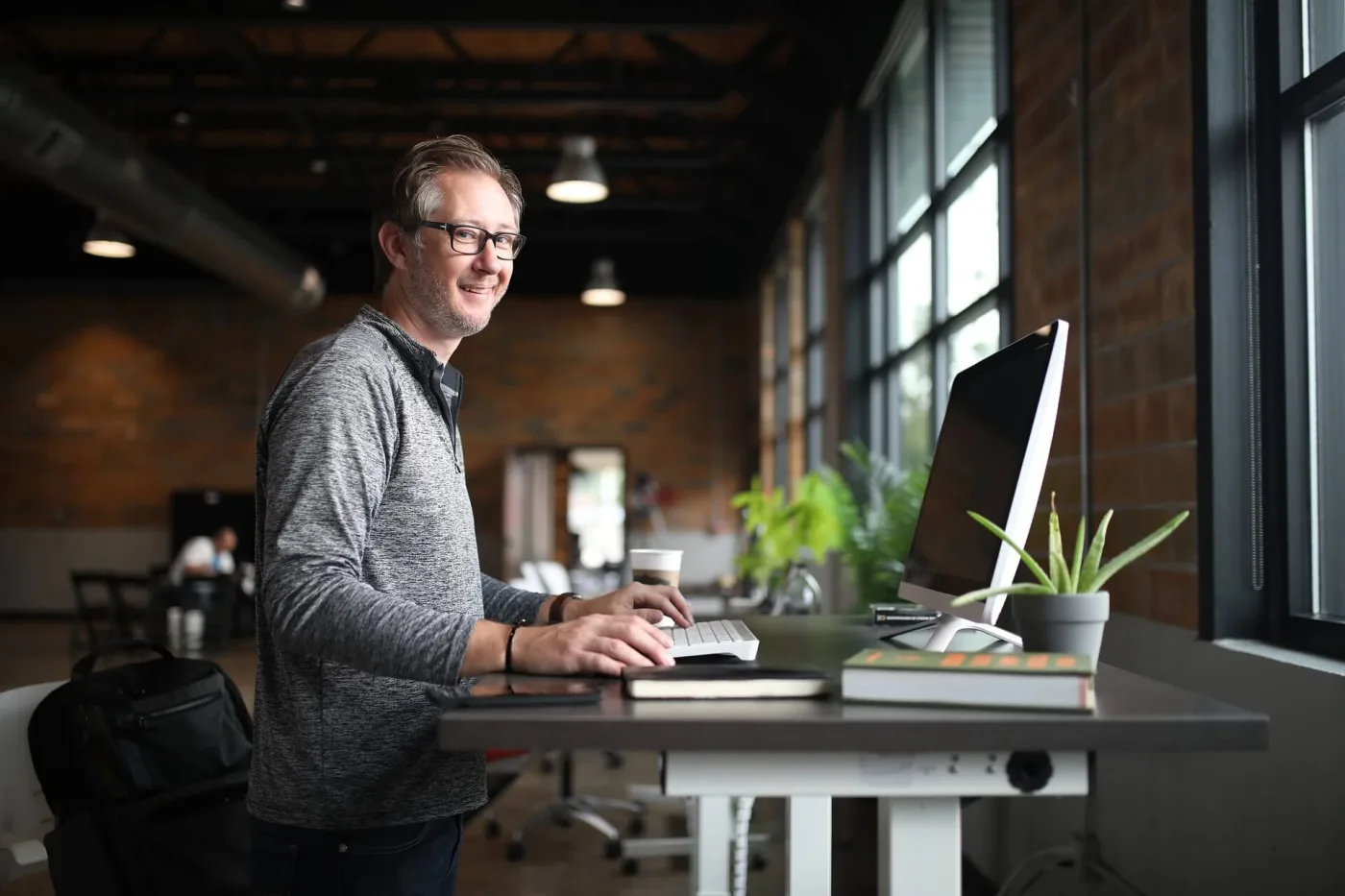 A software engineer working at an office desk